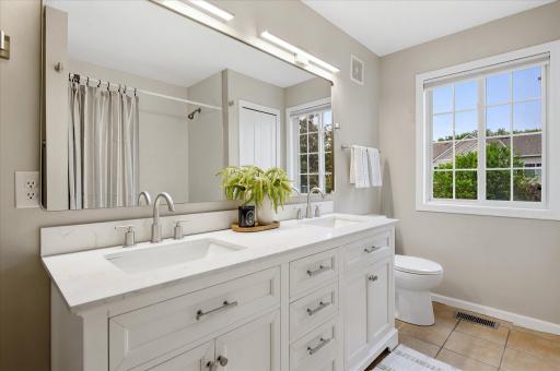 Retreat to the beautifully updated full bathroom featuring dual sinks, modern finishes, and the space you need to start and end each day in comfort.