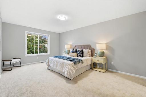 The generously sized primary bedroom offers a peaceful escape with room to relax, unwind, and truly make your own.