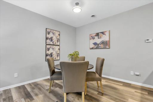 The dining area offers the perfect setting for everything from casual meals to special gatherings, all within the comfort of this bright and connected main level.