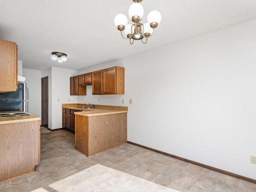 Informal dining and kitchen ( without virtual staging ).