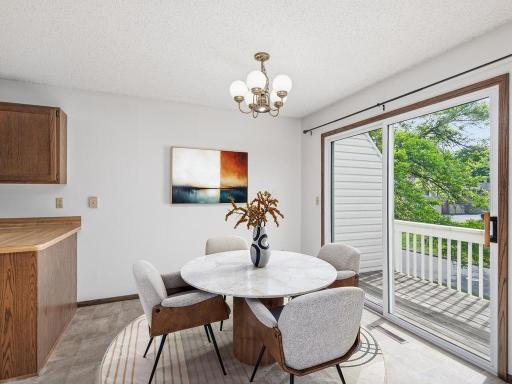 Informal dining with sliding door to deck.