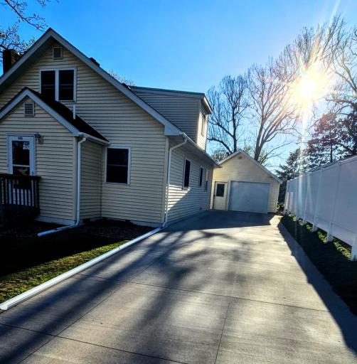 Super long concrete driveway with nice fencing.jpg
