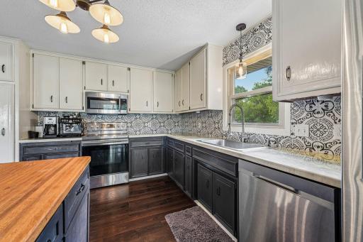 The kitchen offers an abundance of counter space, providing plenty of room for meal prep, entertaining, and everyday cooking with ease.