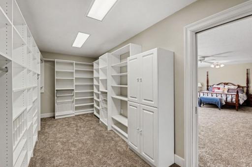 Walk in closet shared by both bedrooms with pocket doors
