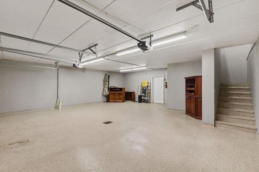 Basement/lower level garage -door to storeroom & stairs to upper level garage 30 x 32