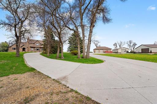 Convenient drive around concrete driveway- and long concrete drive