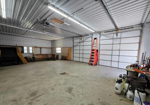 Double detached garage has additional parking
