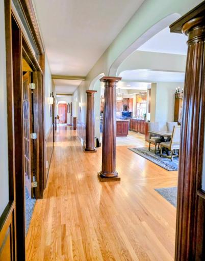 Hallway on main floor with stunning wooden pillars