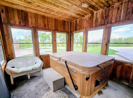 Enjoy the hot tub in the screened in porch