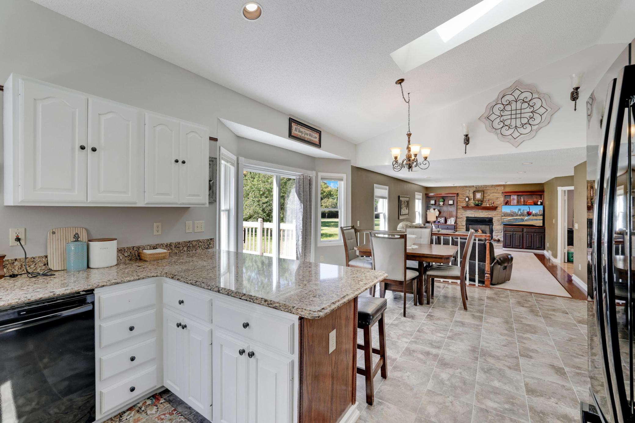 Open concept kitchen/kitchenette and spacious main level living room all located on the backside of the home.