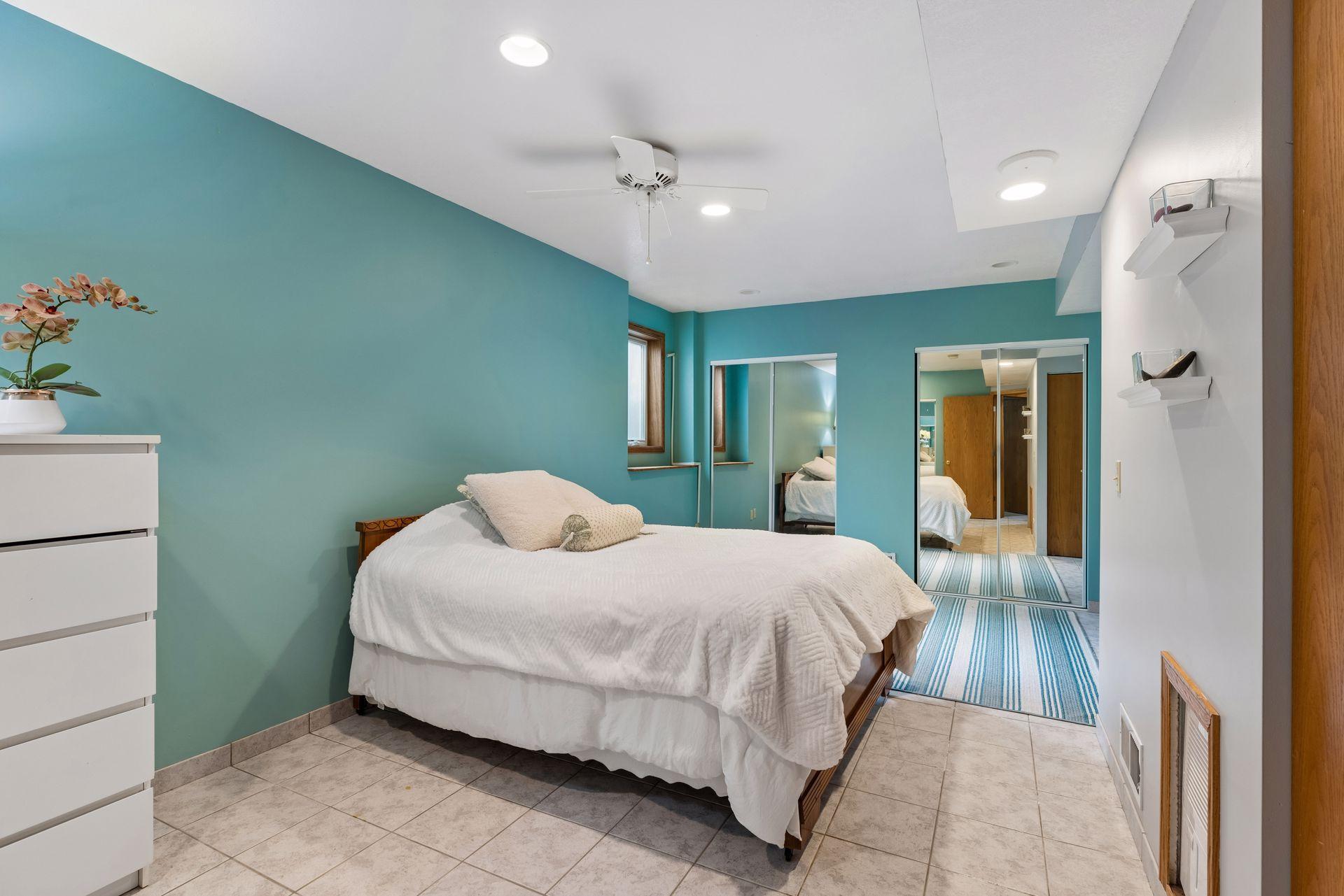 3rd bedroom on the lower level is sizable and includes tile flooring.