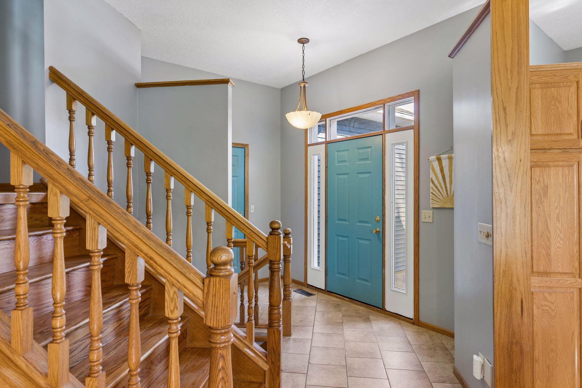 Welcoming entryway with tile flooring and convenient garage access.