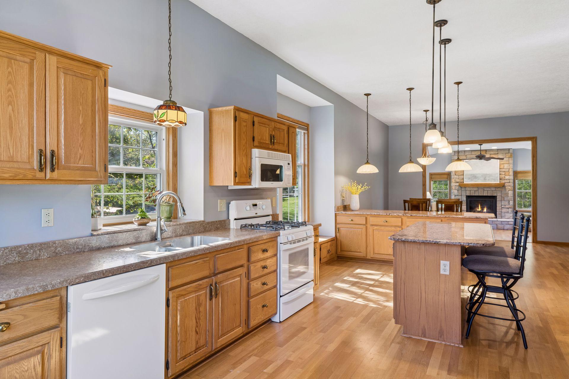 Open layout and wood flooring throughout the main level.