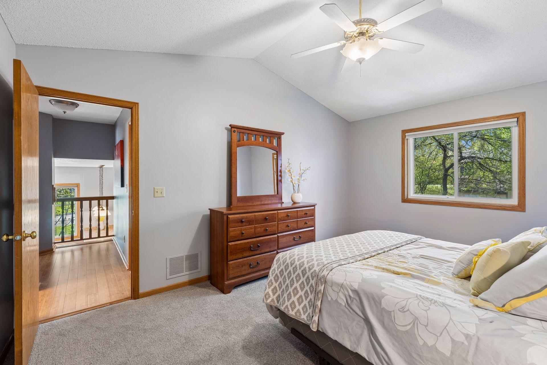 This bedroom also features a walk-in closet.