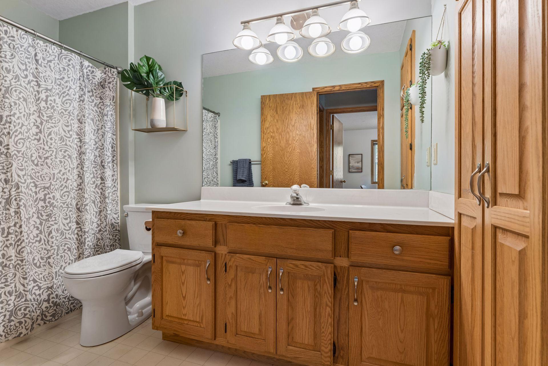 Upper level full bath, with a sizable vanity and linen closet.