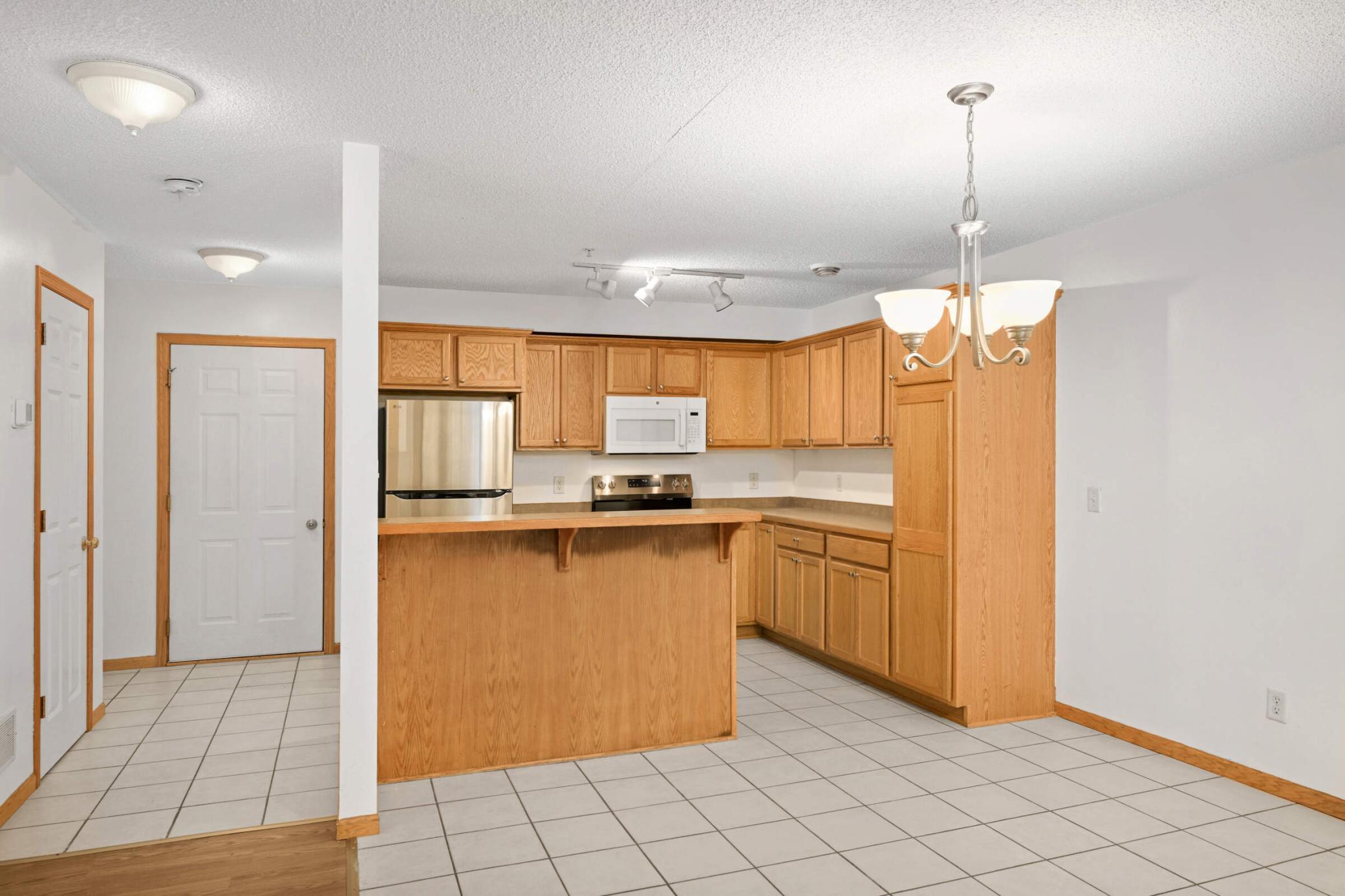 Kitchen with counter seating and dining space