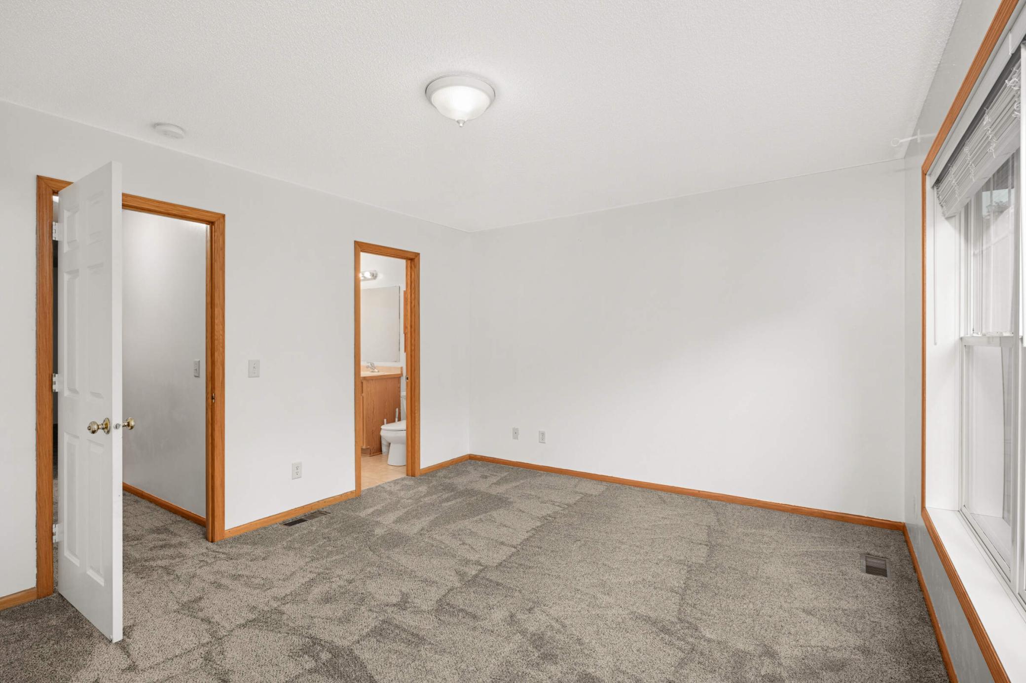 Primary bedroom view toward bath