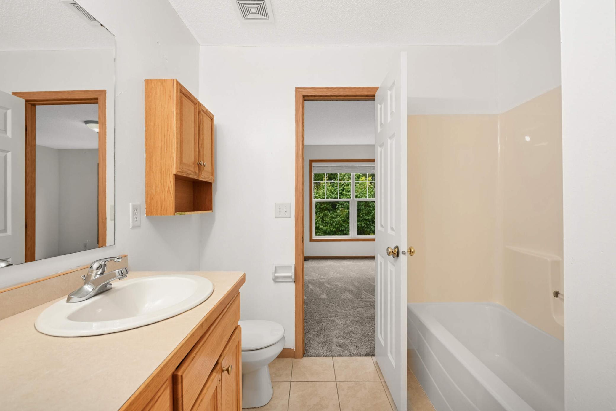 Full bath accessible from primary and family room