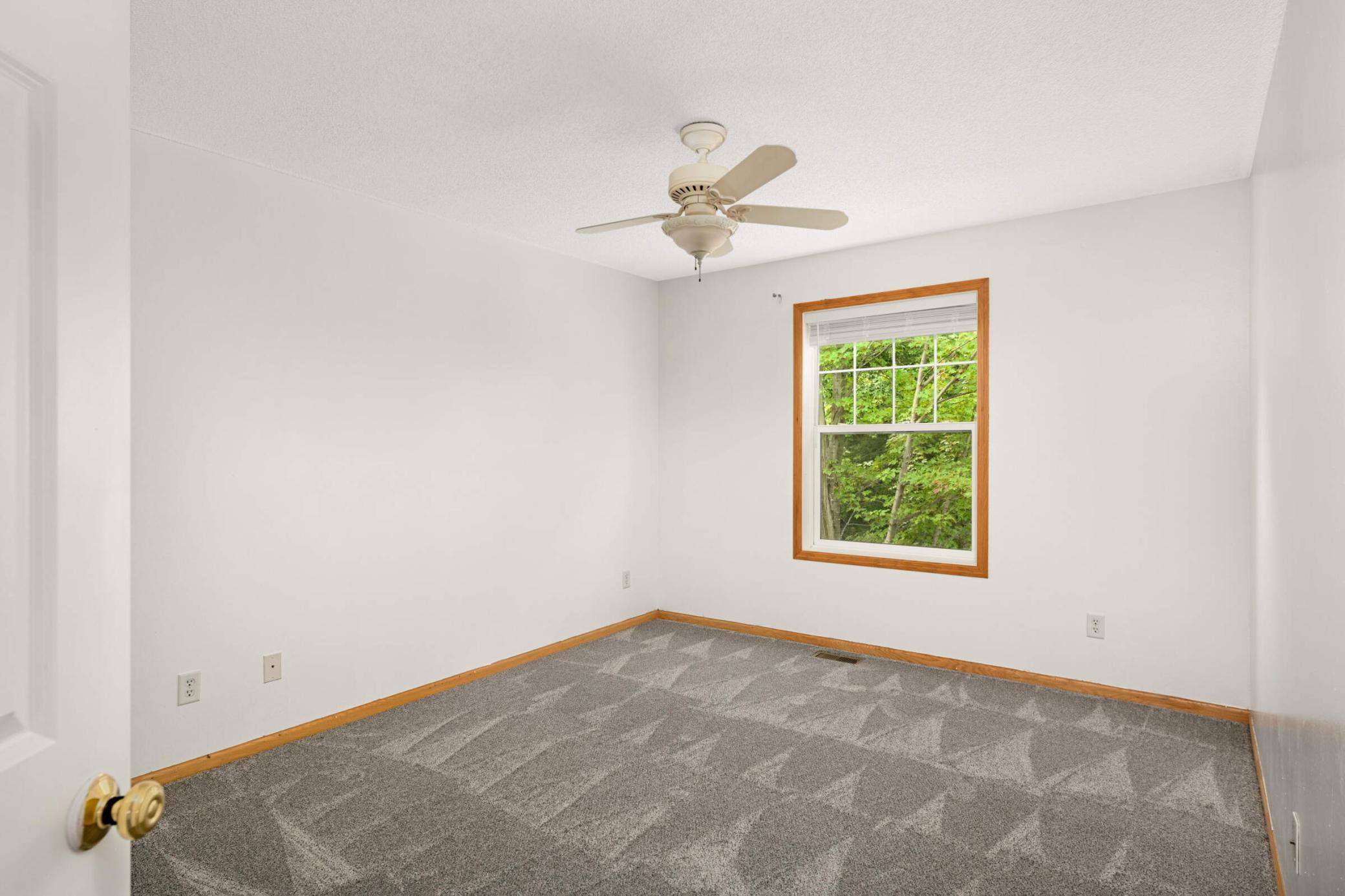 Third bedroom features a ceiling fan
