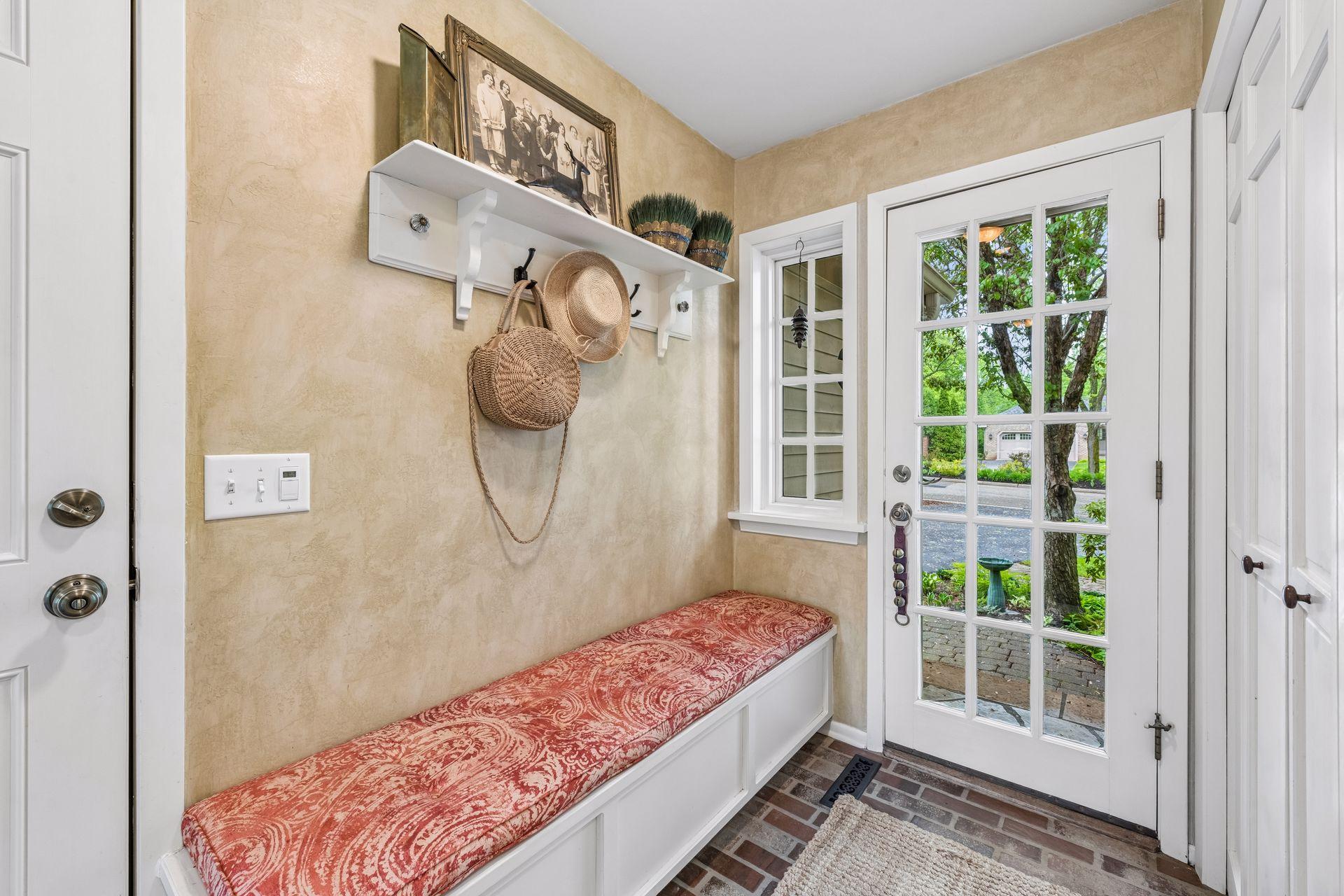 Mudroom and entry from the garage with bench seating