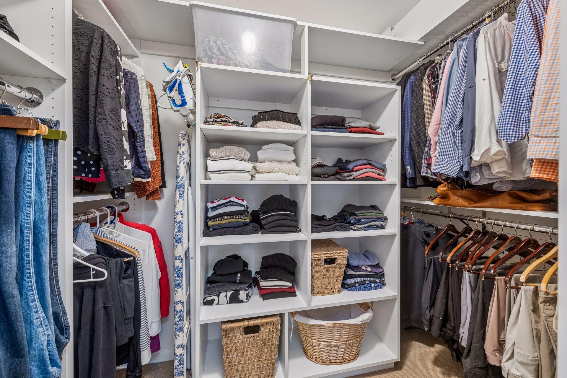 Primary bedroom walk-in closet