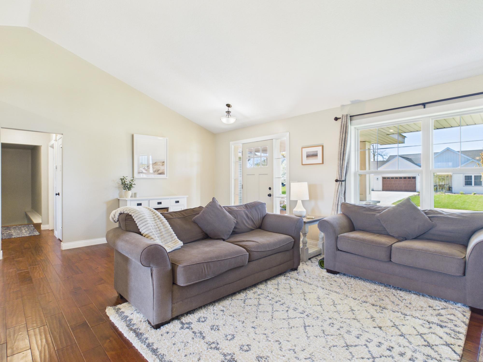 Wide open living room with plenty of natural light.