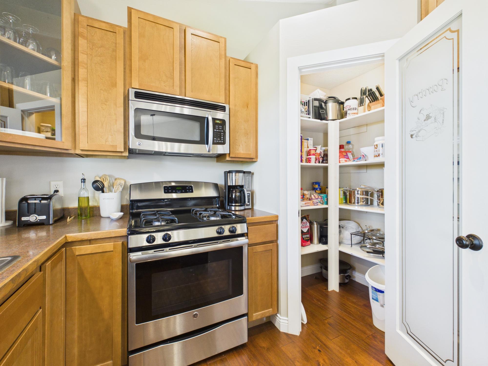 Large pantry in the kitchen with plenty of shelving.