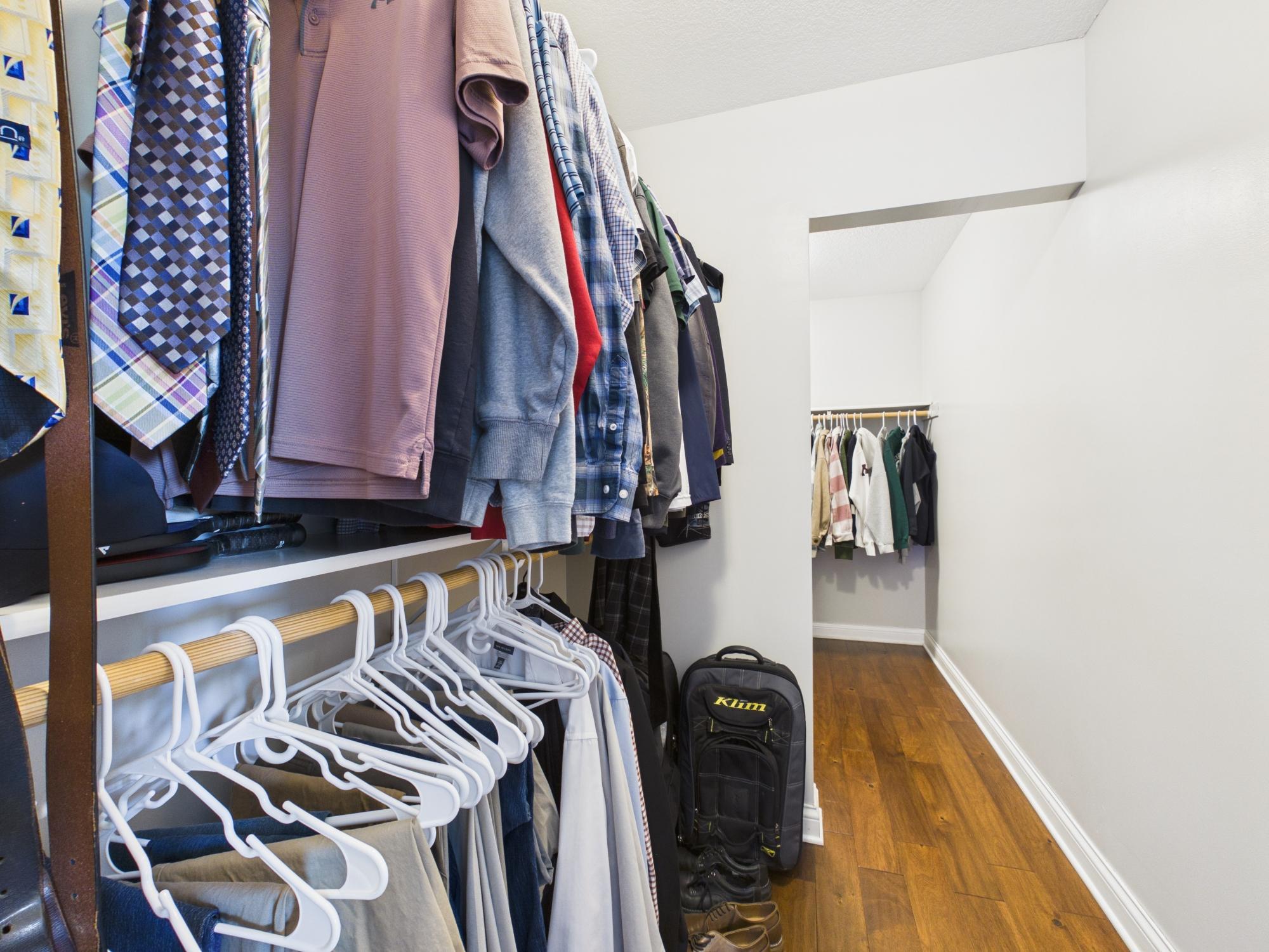 Primary walk-in closet, almost 14' deep!