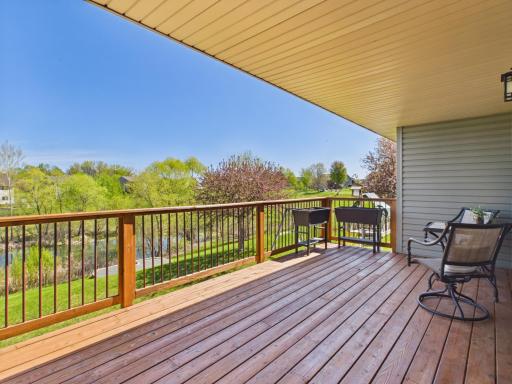 The covered deck overlooks the backyard with a new firepit. Enjoy nature year-round.