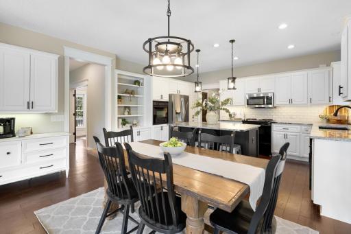 Updated kitchen featuring abundant cabinetry, granite countertops, and stainless steel appliances.