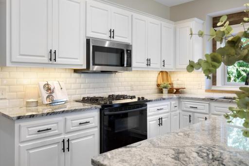 Subway tile backsplash, gas range, and microwave oven