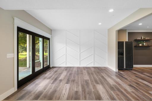 New LVP flooring flows throughout the expansive walkout lower level, creating a fresh, updated space for entertaining and everyday living.