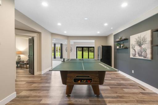 Spacious lower-level gaming area with plenty of room for billiards, ping pong, and endless entertainment.