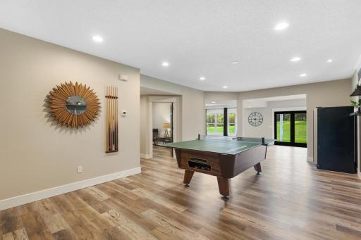 Expansive walkout lower level featuring a spacious recreation and game area—perfect for entertaining family and friends.