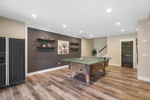Floating decor shelves and lower level refrigerator.