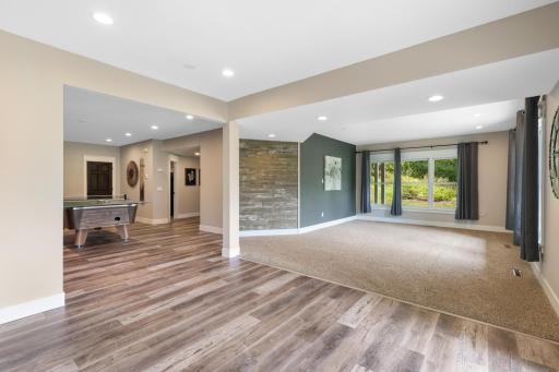Spacious carpeted home theater area offers the perfect setting for movie nights, game days and relaxing with family and friends.