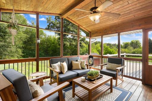 Inviting screened porch just off the kitchen offers a peaceful place to relax, dine and enjoy the beautiful wooded surroundings.