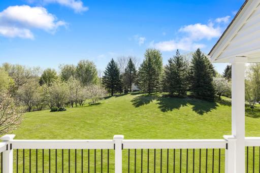 Expansive tree lined green area. Relaxing privacy.