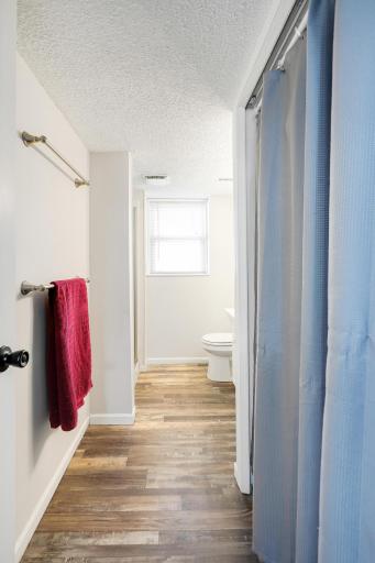 Lower level 3/4 bath with updated flooring.