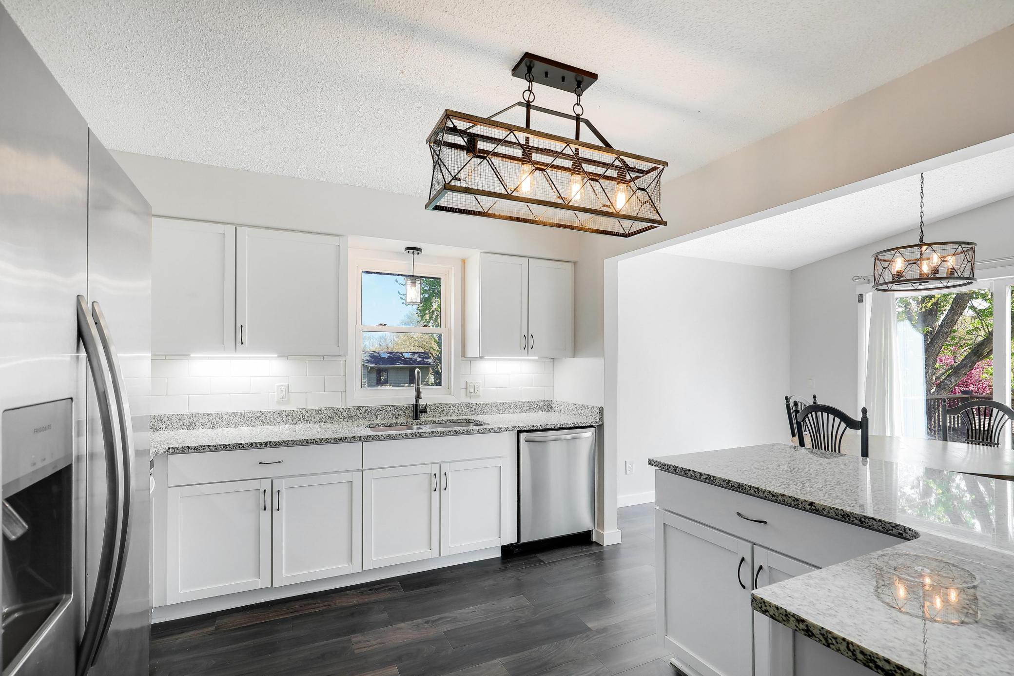 Updated light fixtures can be found throughout the main level, adding a fresh and modern touch.