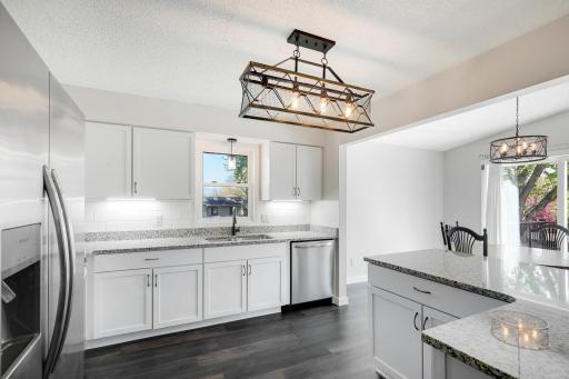 Updated light fixtures can be found throughout the main level, adding a fresh and modern touch.
