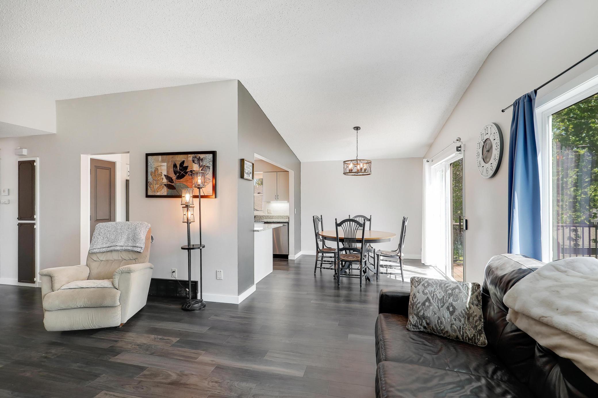 The dining room walks out to the newly rebuilt deck, creating a seamless indoor-outdoor entertaining space.