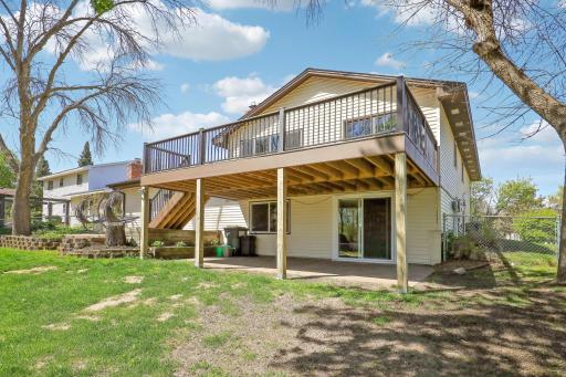The walk-out basement opens to a concrete patio, creating easy access to outdoor living and entertaining space.
