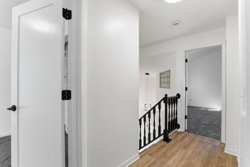 Light and open hallway that ties the upper level together