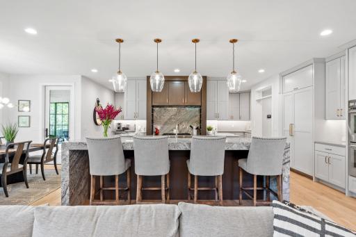 Gourmet Kitchen features oversized waterfall Cambria center island w/ 11â granite counter