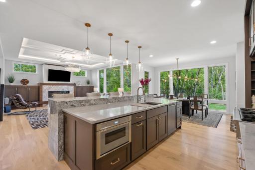 Gourmet Kitchen features oversized waterfall Cambria center island w/ 11â granite counter
