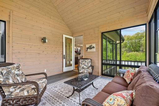 Exceptional 3-season Porch w/ cathedral ceiling, SunSpace windows & Trex flooring overlooks private backyard w/ mature trees