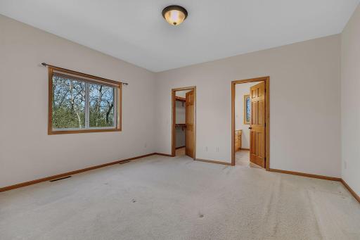 spacious primary suite with full bath and wic