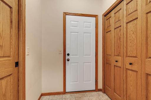 garage entrance with large closet located right off the laundry room