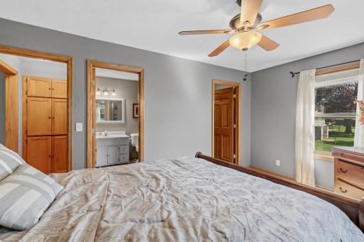 Primary bedroom with walk-in closet and 3/4 bath.